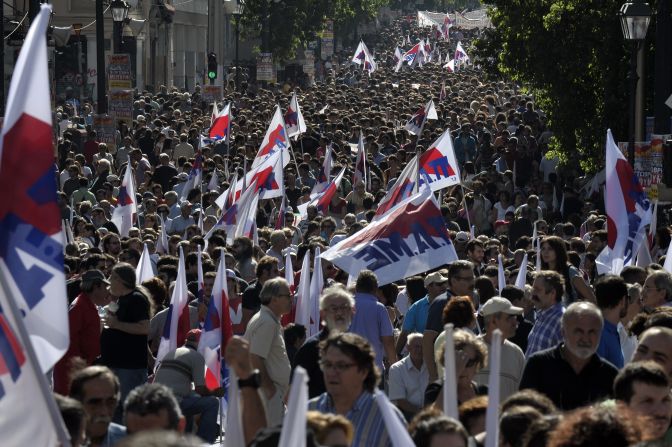 Communist-affiliated protesters gather in central Athens prior to a protest march marking the 24-hour general strike on October 18, 2012.