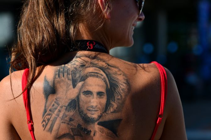 As MotoGP returns to Malaysia for the first time since the tragic death of Marco Simoncelli, the Italian's memory is very much to the fore of the sport. Here, a fan of the rider, shows her devotion with a tattoo in tribute to her hero who died following a fatal crash on October 23 2011.