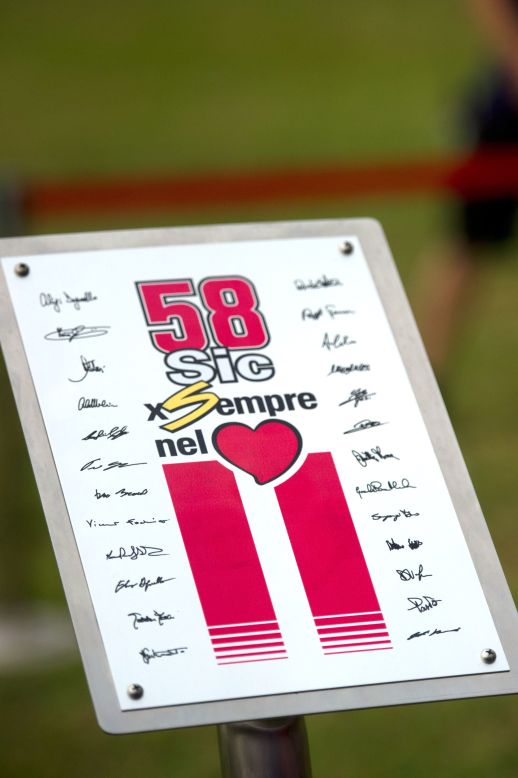 The whole of the MotoGP world stopped in silence at the unveiling of a plaque in memory of the Italian during the ''Tribute for Marco Simoncelli' ahead of the race in Malaysia. The number '58' which was Simoncelli's number and his nickname 'Sic' are both included on the memorial.