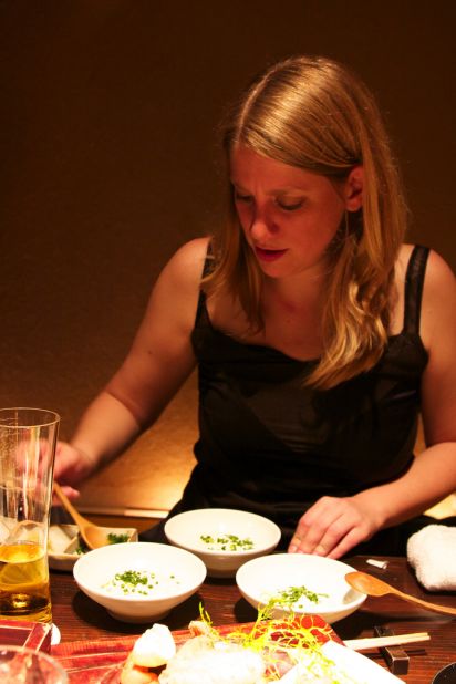 Here she gets to grip with three different types of Tofu at a restaurant in Tokyo, Japan.