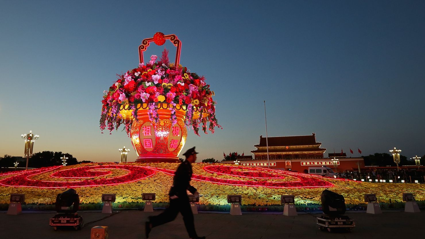 A giant flower looms over Tiananmen Square as Beijing prepares for China's once-in-a-decade leadership change.