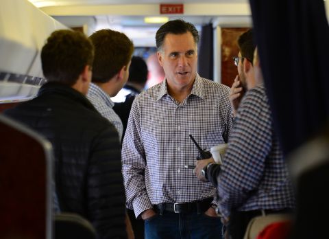 Romney speaks with campaign staff on board his campaign plane at Washington Dulles International Airport in Chantilly, Virginia, on Thursday, October 18.