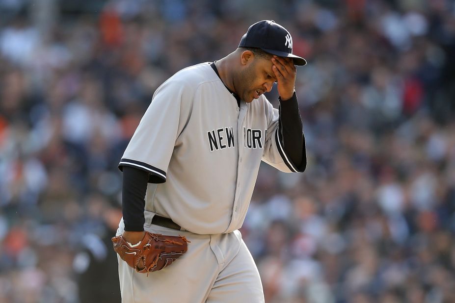 Pitcher CC Sabathia of the New York Yankees wipes his forehead during Game 4.