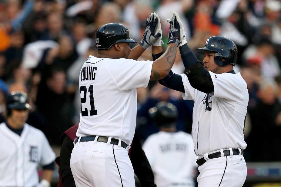 Delmon Young, left, and Jhonny Peralta of the Detroit Tigers celebrate after scoring on Peralta's two-run home run in the bottom of the fourth inning against the New York Yankees during Game 4 of the American League Championship Series at Comerica Park in Detroit on Thursday, October 18.