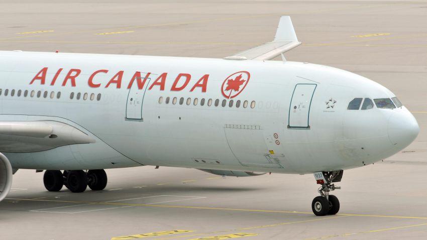 The plane of Air Canada, with German-Canadian arm dealer Karlheinz Schreiber on board, arrives at the airport of Munich, southern Germany on August 3, 2009. The 75-year-old will have to face tax evasion and bribery charges following a decade-long battle to avoid extradition, authorities said. Schreiber is accused of playing a key role in a sprawling slush-fund scandal that rocked the Christian Democratic Union (CDU) party in the 1990s and tarnished the legacy of former chancellor Helmut Kohl. AFP PHOTO DDP/ JOERG KOCH GERMANY OUT (Photo credit should read JOERG KOCH/AFP/Getty Images)  