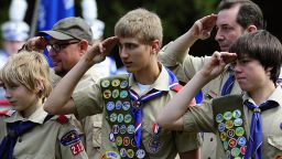 Members of the Boy Scouts salute during the raising of the flag on May 25, 2009 at the Willow River Cemetery in Hudson, Wisconsin during Memorial Day ceremonies. Cities and towns across the US Held ceremonies to honor those who served in the military and those who died in wars. AFP PHOTO/Karen BLEIER (Photo credit should read KAREN BLEIER/AFP/Getty Images)