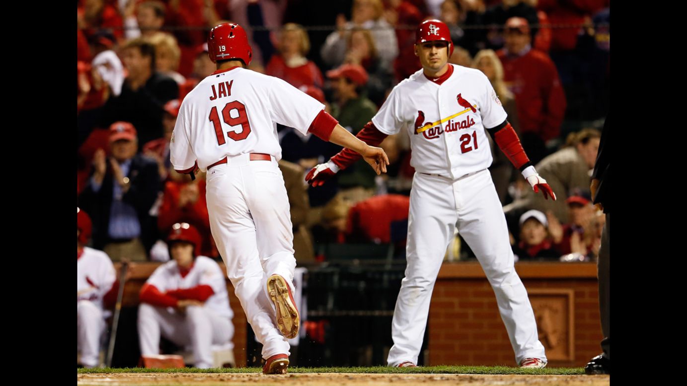 JJon Jay  and  Allen Craig of the St. Louis Cardinals celebrate after Jay scores on a single by Matt Holliday in the first inning against the San Francisco Giants in Game 4 of the National League Championship Series at Busch Stadium on October 18, in St Louis, Missouri. <a href="http://www.cnn.com/2012/10/17/worldsport/gallery/nlcs-game-3/index.html" target="_blank">Look back at Game 2 of the NLCS.</a>