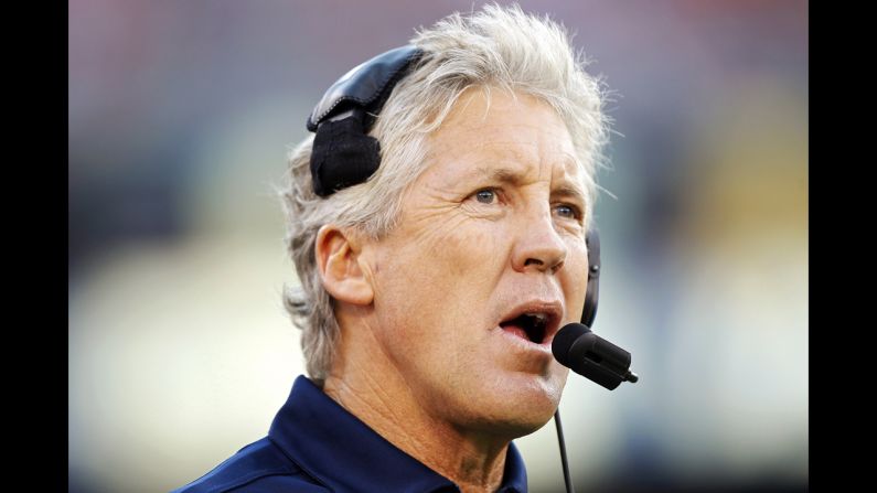 Head coach Pete Carroll of the Seattle Seahawks makes a call from the sidelines against the San Francisco 49ers in the first quarter.