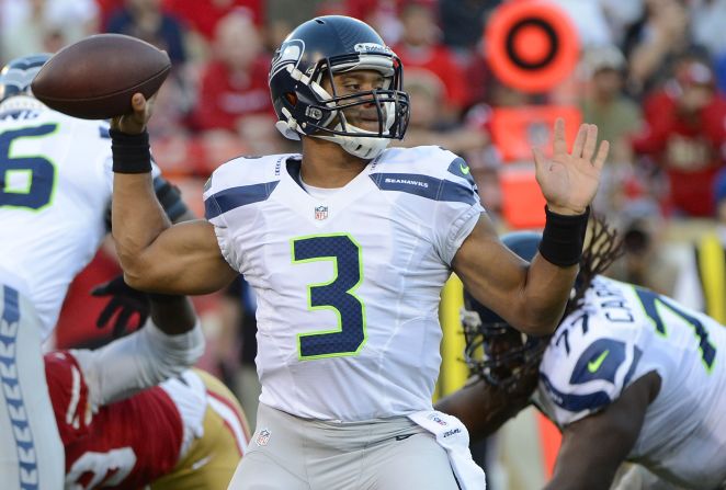 Russell Wilson of the Seattle Seahawks drops back to pass against the San Francisco 49ers.