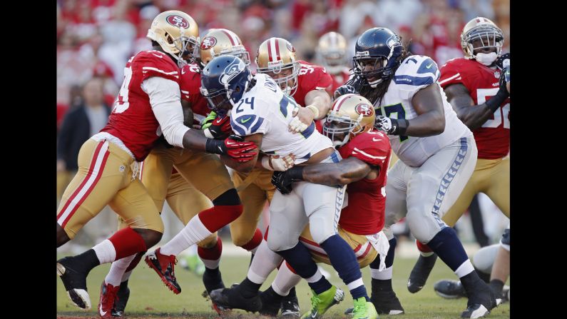Marshawn Lynch of the Seattle Seahawks is overcome by the San Francisco 49ers defense as he runs the ball. <a href="index.php?page=&url=http%3A%2F%2Fwww.cnn.com%2F2012%2F10%2F11%2Fworldsport%2Fgallery%2Fnfl-week-6%2Findex.html"><strong>Look back at the best from Week Six of the NFL.</strong></a>