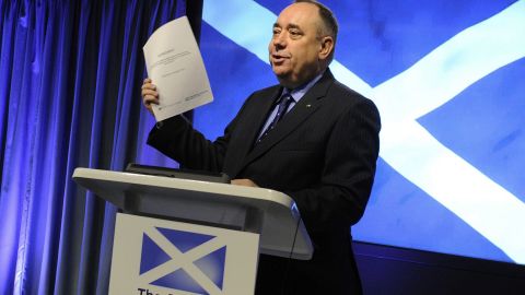 Scotland's First Minister Alex Salmond holds up the signed agreement for a referendum on Scottish independence.