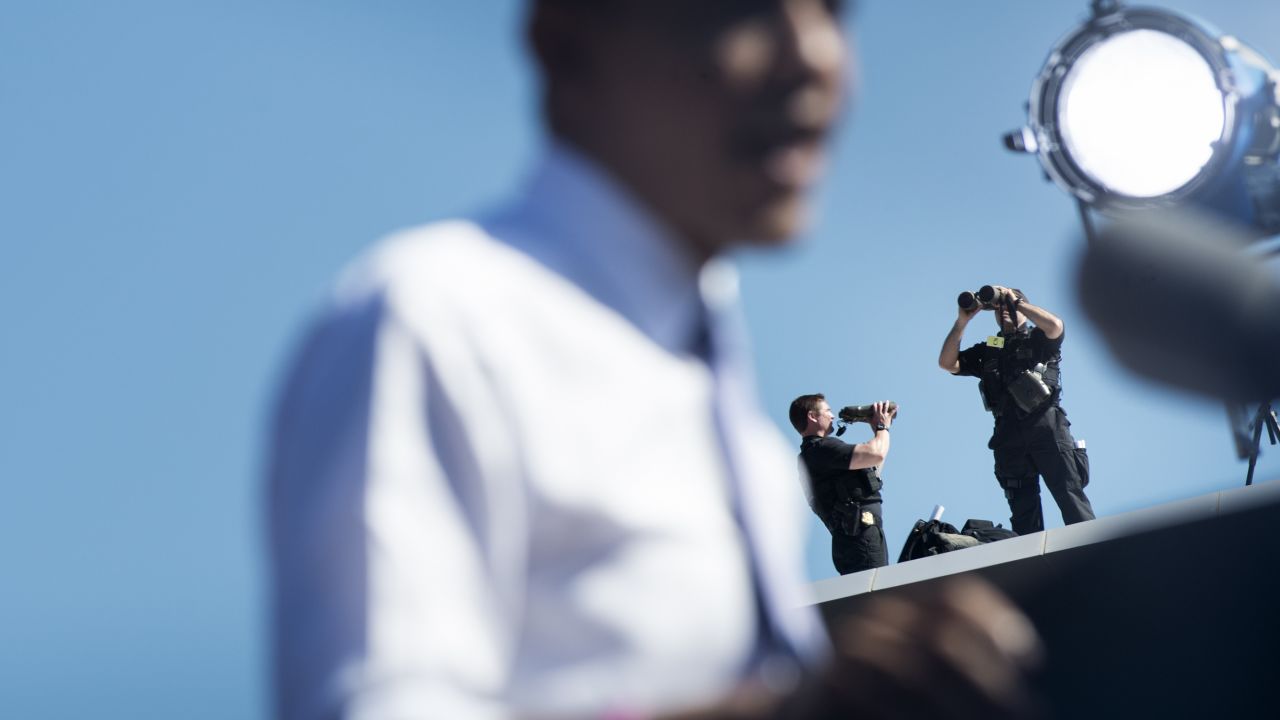 Secret Service members watch Thursday as President Obama speaks at Veterans Memorial Park in Manchester, New Hampshire. 