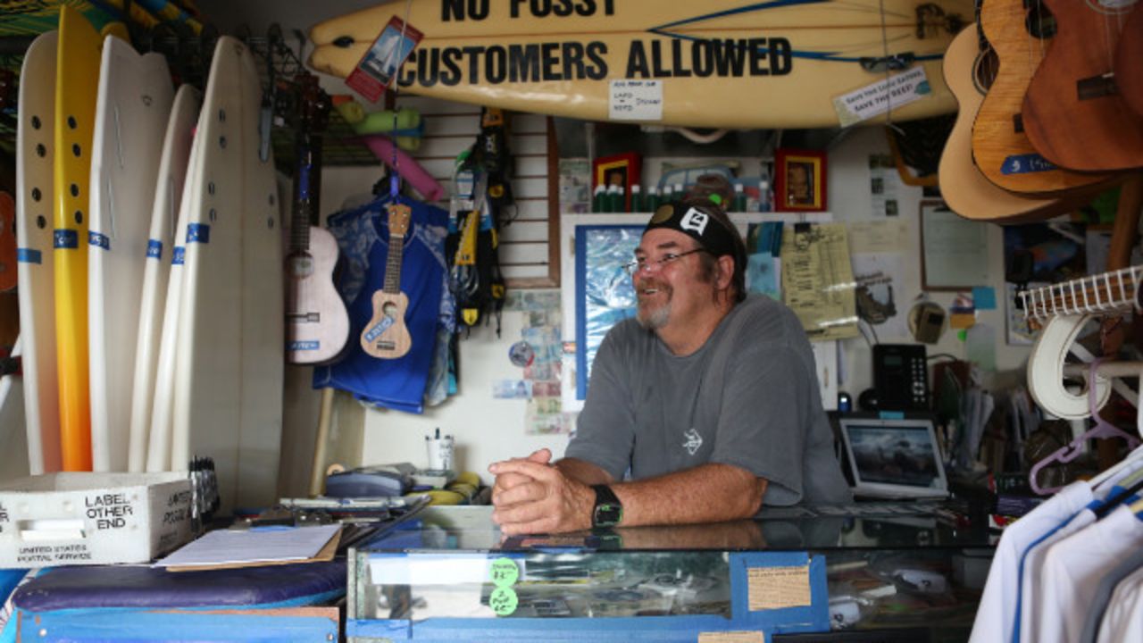 Surf shop owner Wayno Cochran tries to convince surfers to care about environmental issues.