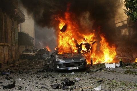 A car burns after an explosion in Beirut's predominantly Christian district of Ashrafiyeh. 