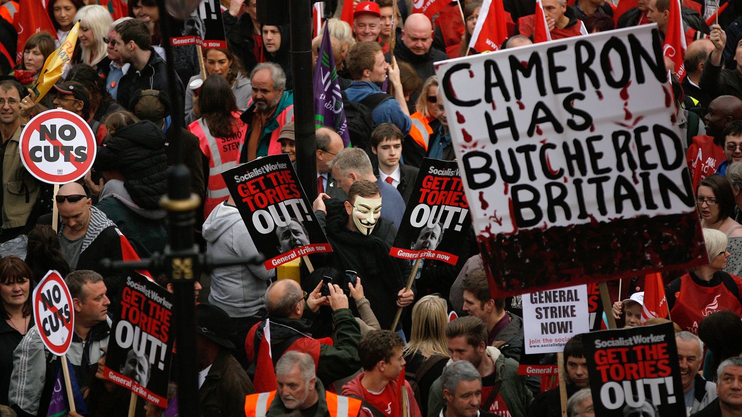 Demonstrators take part in a march in protest against the government's austerity measures on October 20, 2012 in London.