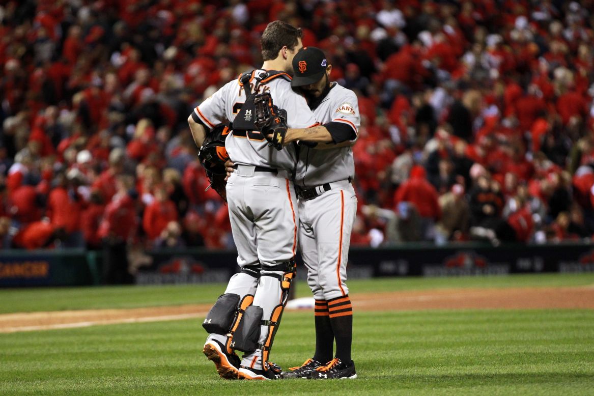 No.28 Catcher Buster Posey and No. 54 Sergio Romo of the San Francisco Giants celebrate the Giants 5-0 victory over the St. Louis Cardinals in Game 5 of the National League Championship Series at Busch Stadium on October 19, 2012, in St. Louis, Missouri. <a href="http://www.cnn.com/2012/10/18/worldsport/gallery/nlcs-game-4/index.html">Look back at Game 4 of the NLCS</a>.