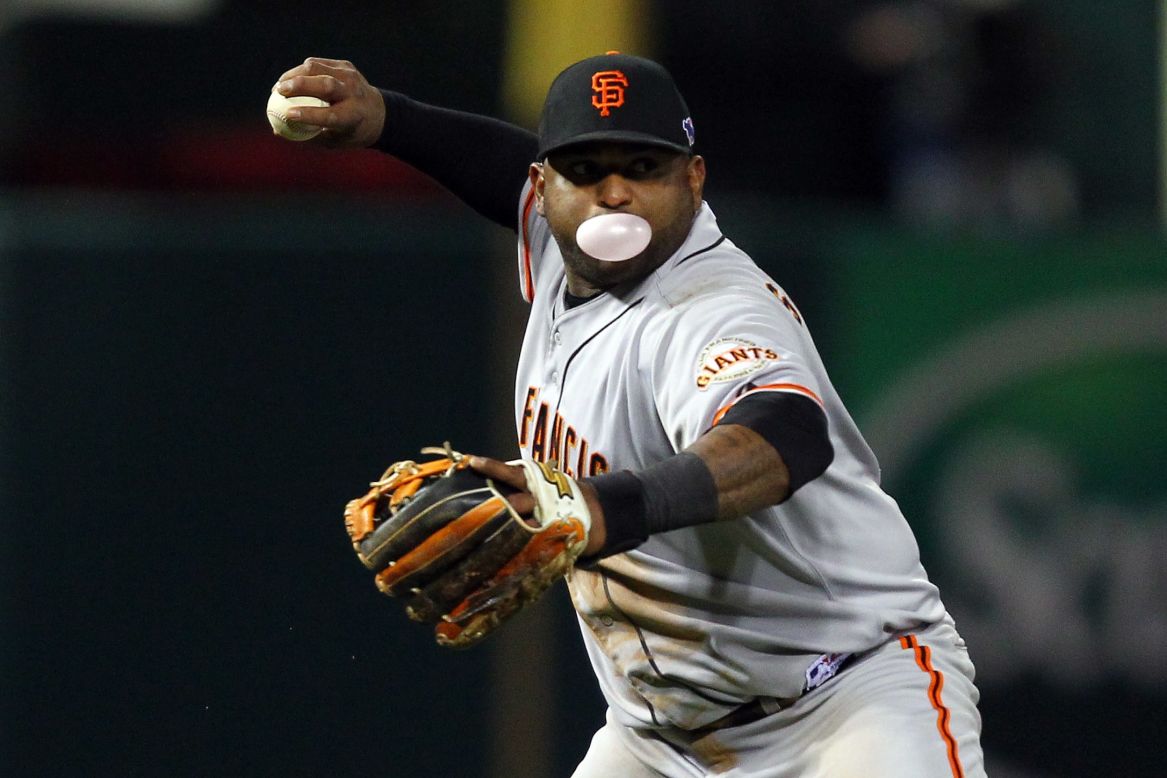 No.48 Pablo Sandoval of the Giants throws the ball to first base in the fifth inning.