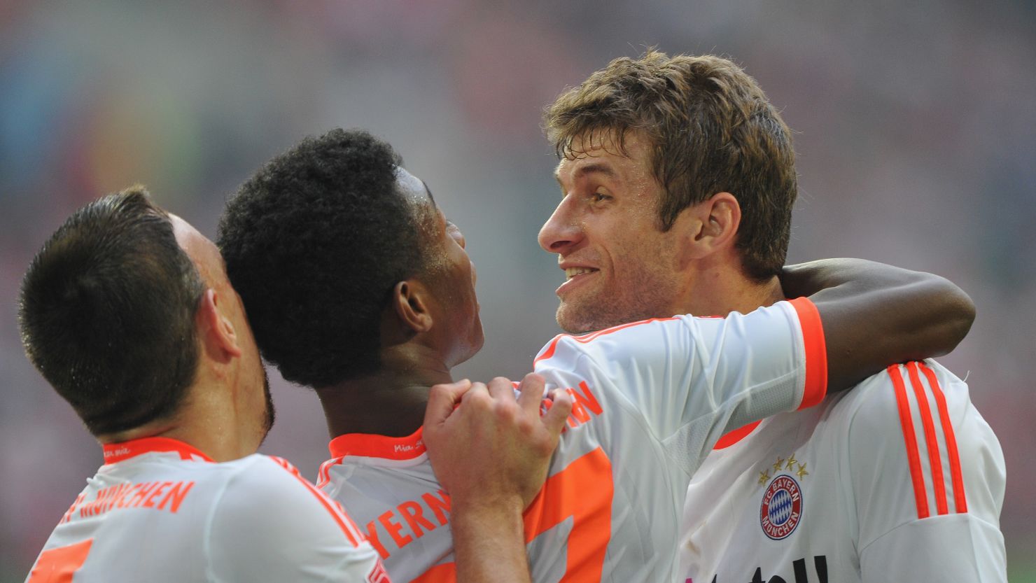 Thomas Mueller (right) celebrates with David Alaba (center) and Franck Ribery as Bayern Munich extended thier winning run.
