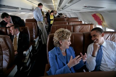 Obama and Clinton talk on the plane on their way to a rally in Unity, New Hampshire, in June 2008. She had recently ended her presidential campaign and endorsed Obama.
