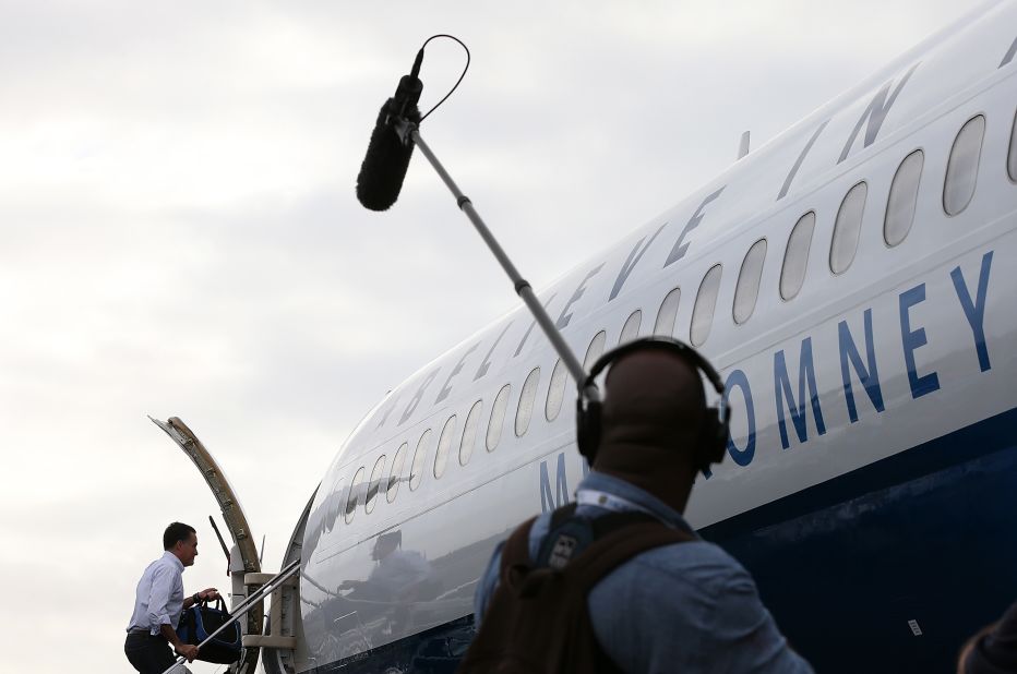 Romney boards his campaign plane at Newark Liberty International Airport on Friday, October 19.