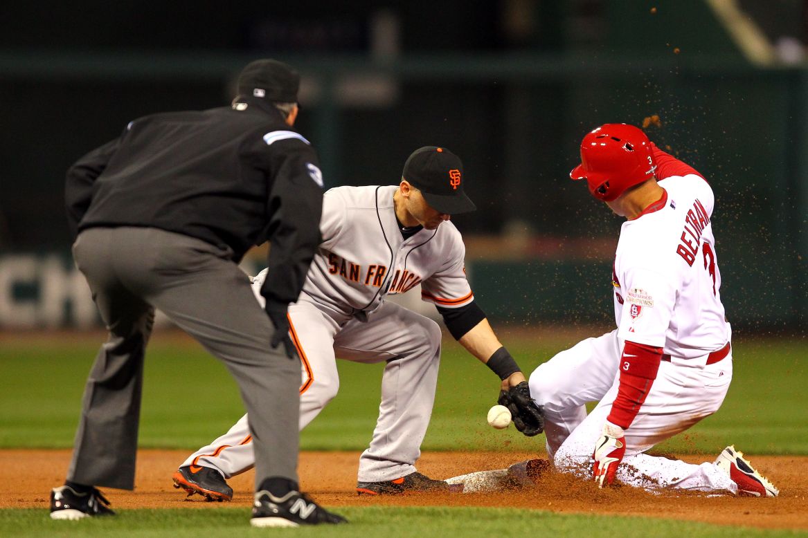 No. 3 Carlos Beltran of the St. Louis Cardinals steals second base covered by No. 19 Marco Scutaro of the San Francisco Giants in the first inning.