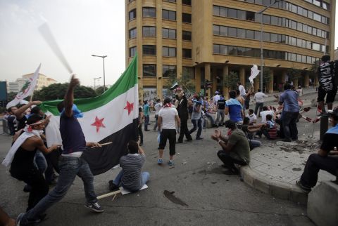 Protesters hurled sticks, stones and flags on Sunday. A number of injuries were reported, Lebanon's National News Agency said.