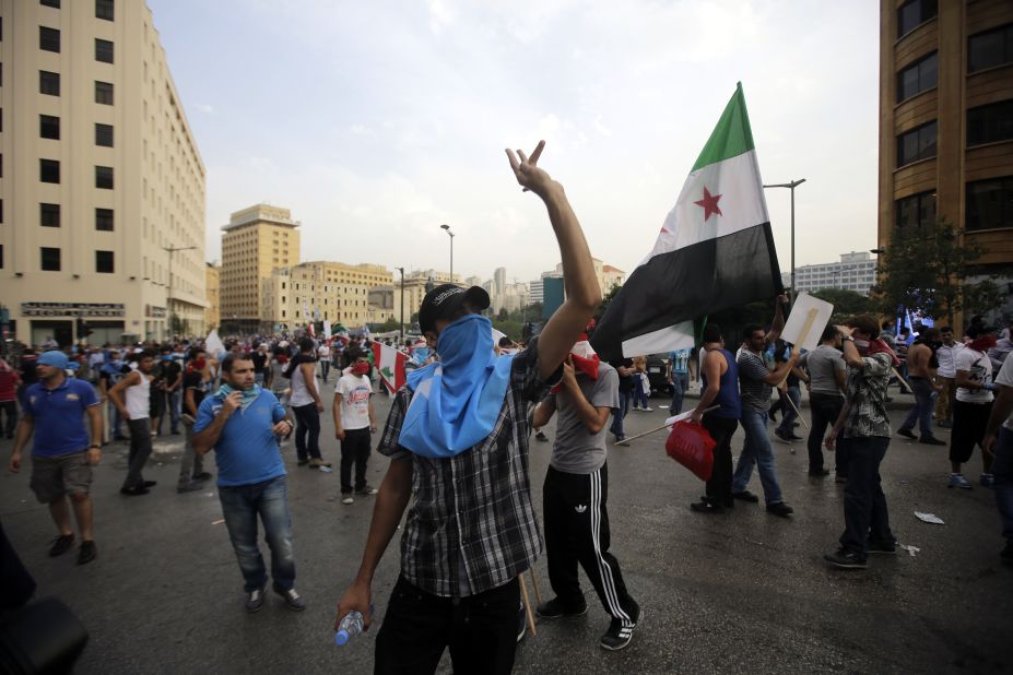 Anti-government protesters demonstrate outside the government palace on Sunday.