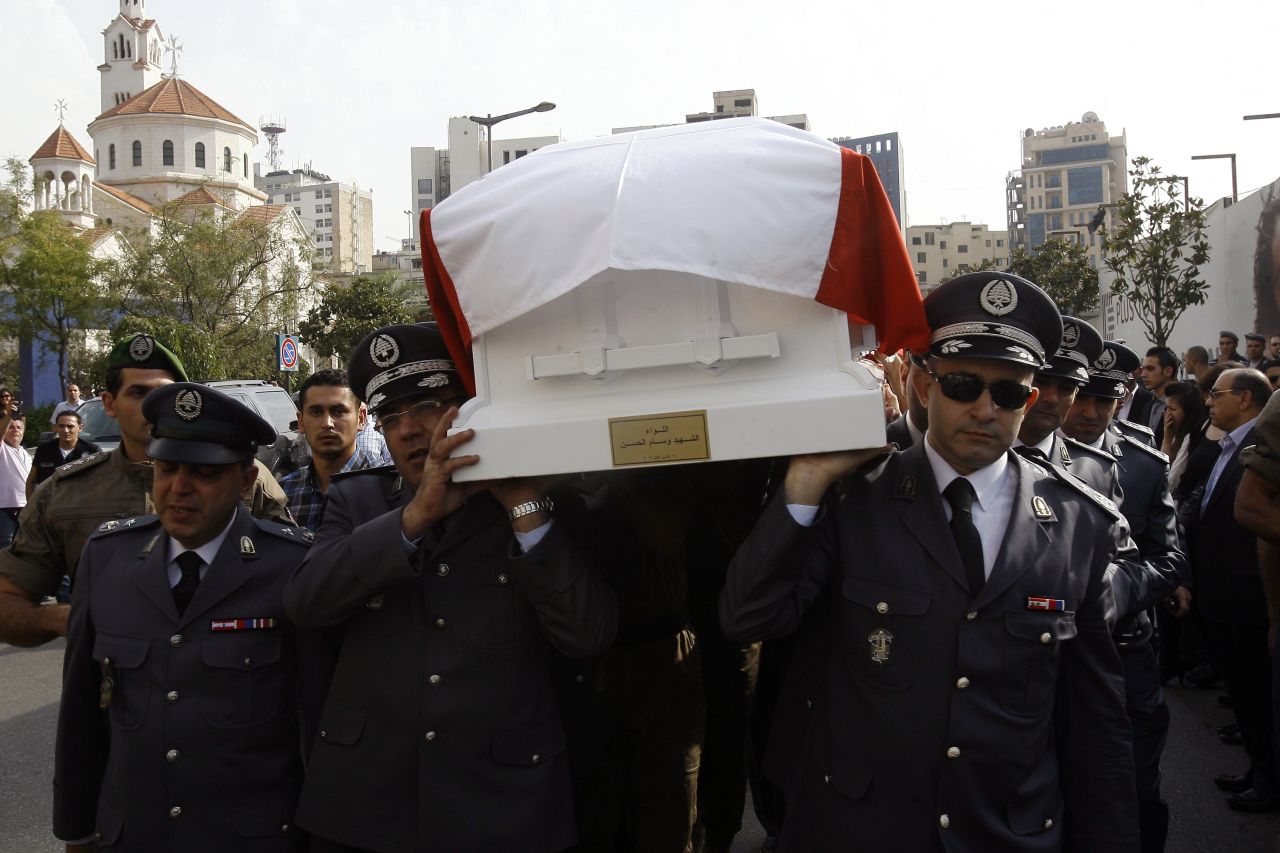 Lebanese officers of the Internal Security Forces carry the intelligence chief's coffin on Sunday.