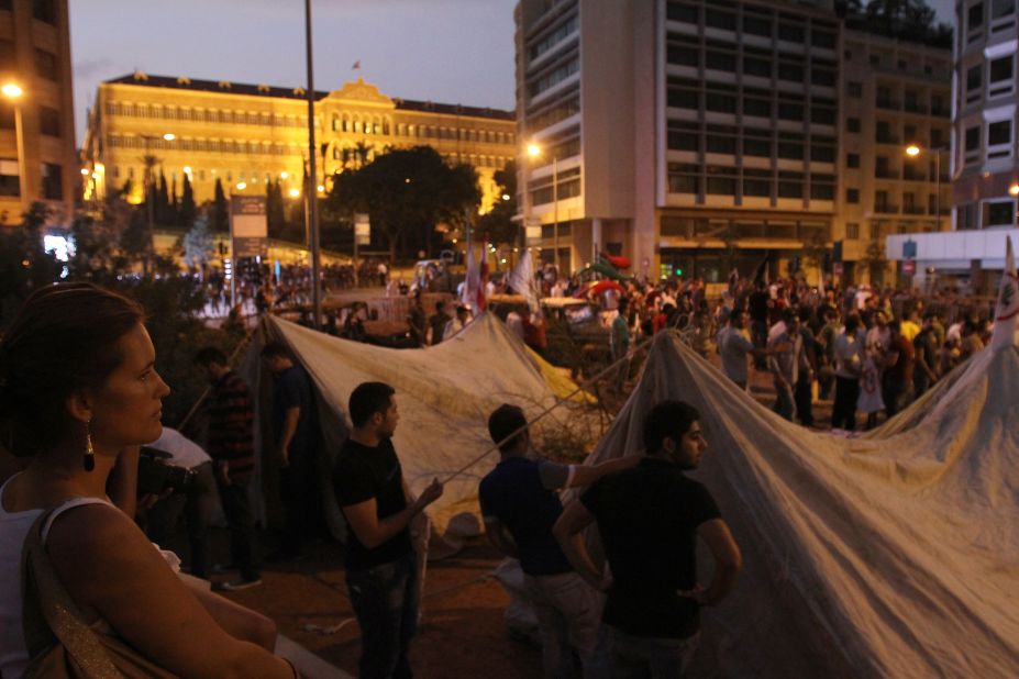 People set up tents and gather outside the headquarters of the Prime Minister of Lebanonon on Saturday night.