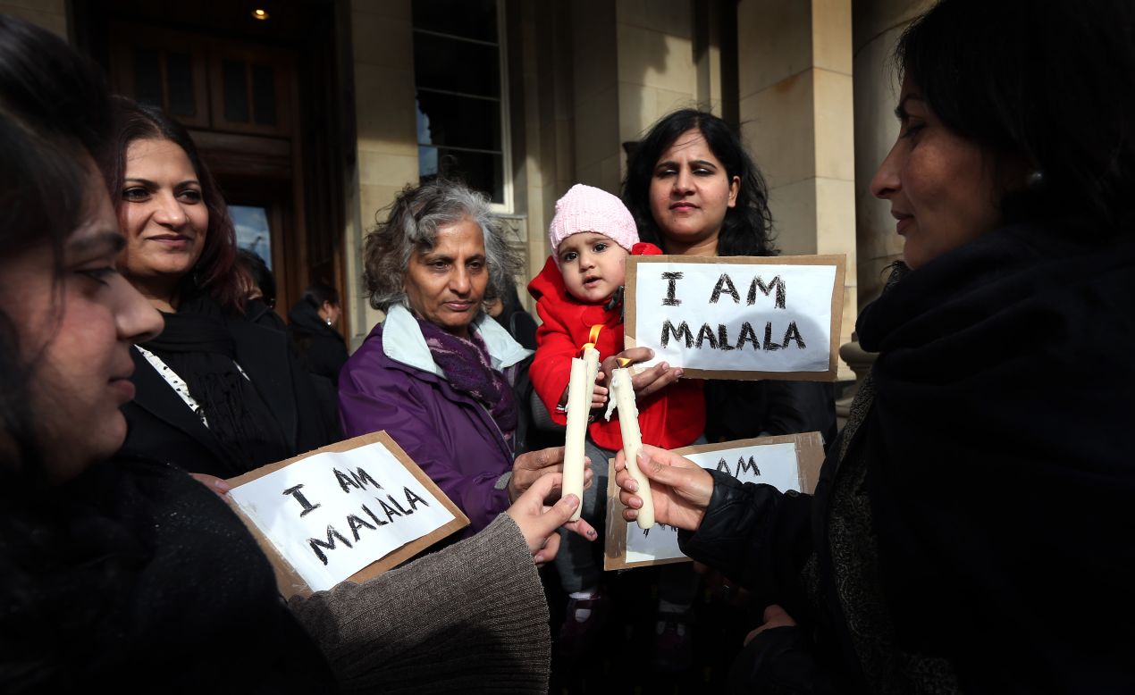 Campaigners gather Friday for a vigil for Malala in Birmingham, England.