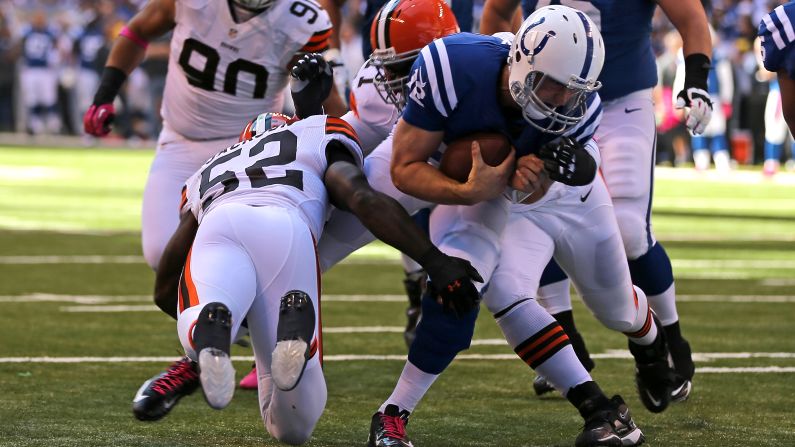 Andrew Luck of the Indianapolis Colts breaks a tackle attempt by No.52 D'Qwell Jackson and No. 71 Ahtyba Rubin of the Cleveland Browns to score a touchdown on Sunday.