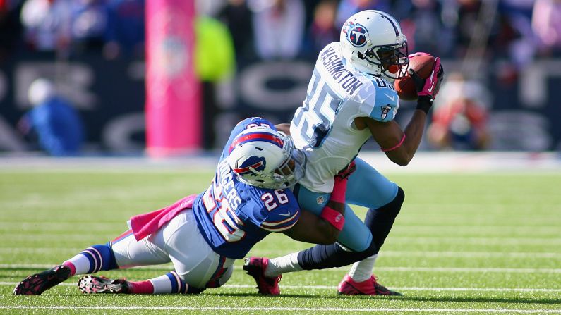 Nate Washington of the Tennessee Titans makes a catch against Justin Rogers of the Buffalo Bills on Sunday at Ralph Wilson Stadium in Orchard Park, New York.