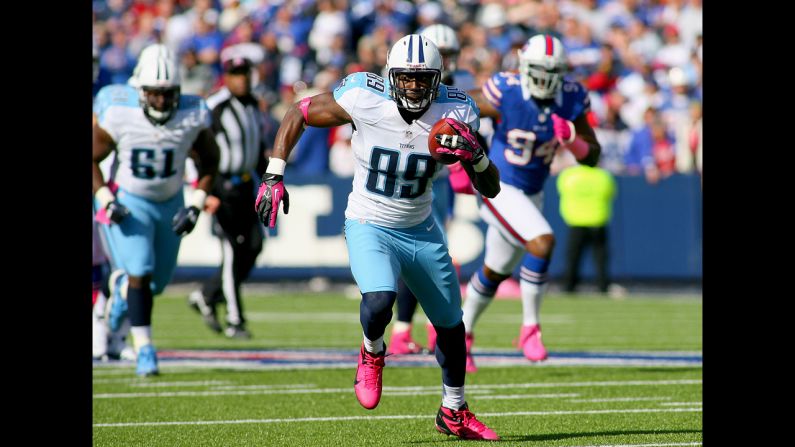 Jared Cook of the Titans runs after a pass reception against the Bills.