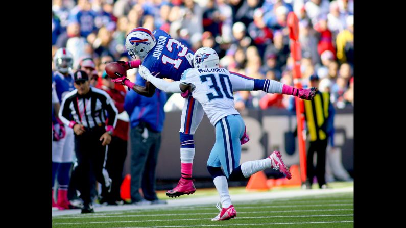 Steve Johnson of the Bills makes a catch against Jason McCourty of the Titans.