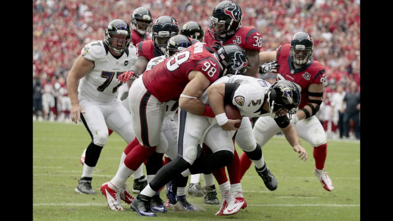 Connor Barwin of the Houston Texans sacks quarterback Joe Flacco of the Baltimore Ravens for a safety.