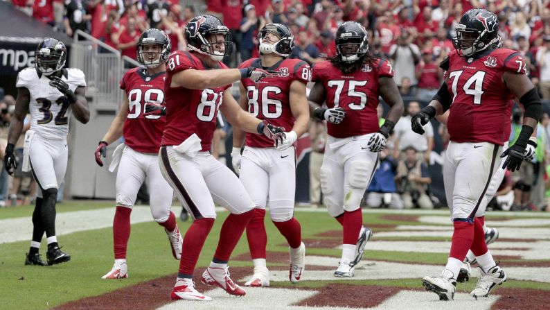 No. 81 Owen Daniels of the Houston Texans celebrates with teammates after catching a touchdown reception Sunday.