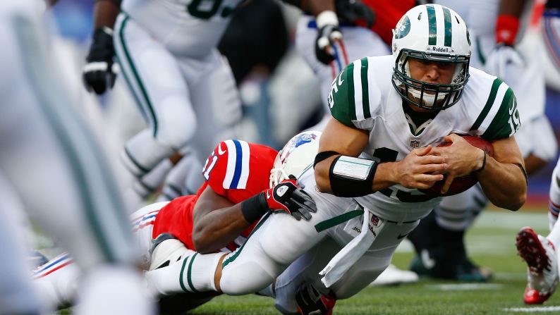 Quarterback Tim Tebow of the New York Jets runs the ball against the New England Patriots on Sunday at Gillette Stadium in Foxboro, Massachusetts.