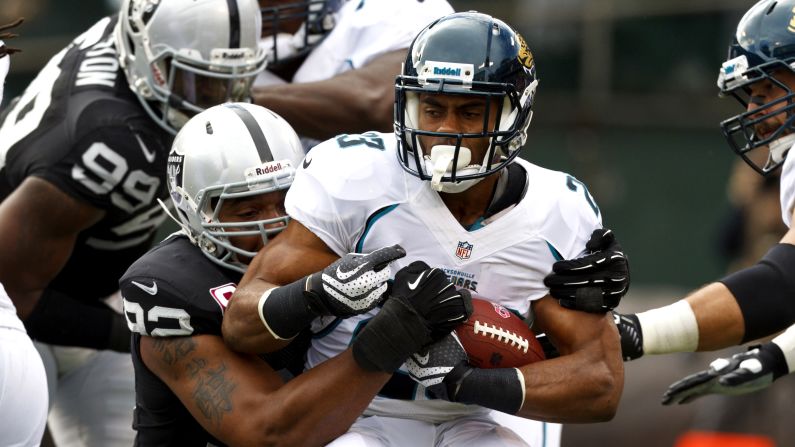Rashad Jennings of the Jacksonville Jaguars is tackled by Richard Seymour of the Oakland Raiders in the backfield on Sunday at O.co Coliseum in Oakland, California.
