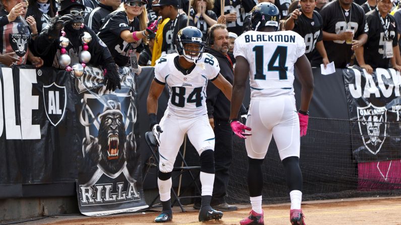 Cecil Shorts of the Jaguars celebrates with teammate Justin Blackmon after scoring a touchdown Sunday.