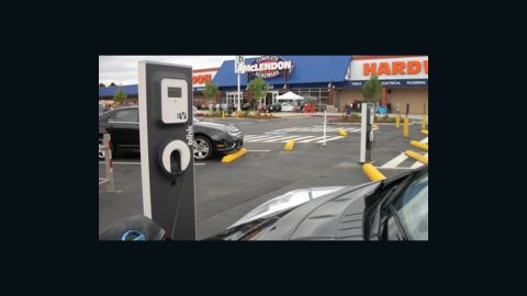 Businesses, such as this hardware store in Seattle are increasingly putting car chargers in their parking lots. 