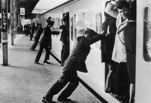 "Oshiya" ("pushers") at Tokyo's Shinjuku station in the rush hour in 1967. They are employed to pack as many passengers as possible into the carriages. "The peak rush hour is really unbelievable. I've only been a few times and I've really made an effort to avoid it ever since because it is really crowded. It's like a cattle cart," says Barron. 