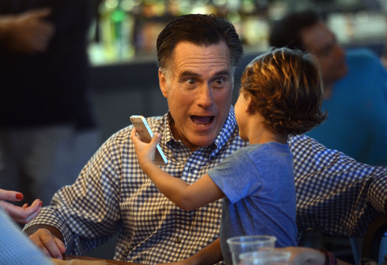 Republican candidate Mitt Romney plays with his grandson while having dinner on Sunday in Delray Beach, Florida.