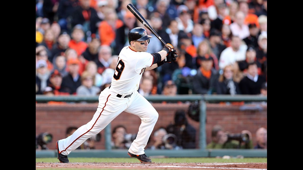 No. 19 Marco Scutaro of the Giants singles in the first inning.