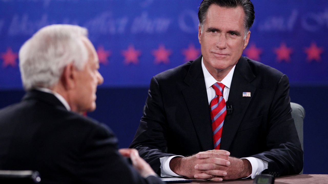Romney listens as Schieffer speaks during Monday night's debate.