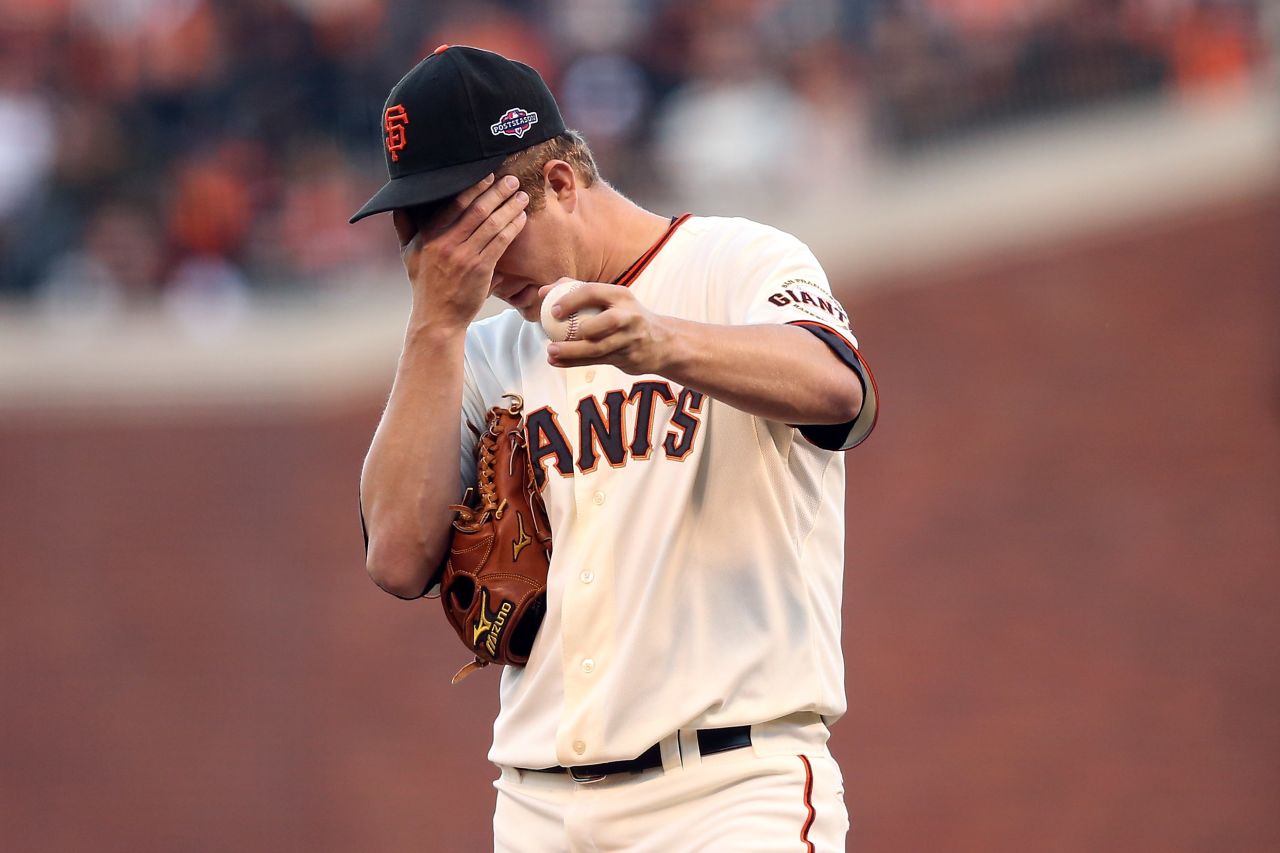 No. 18 Pitcher Matt Cain of the Giants reacts in the second inning.