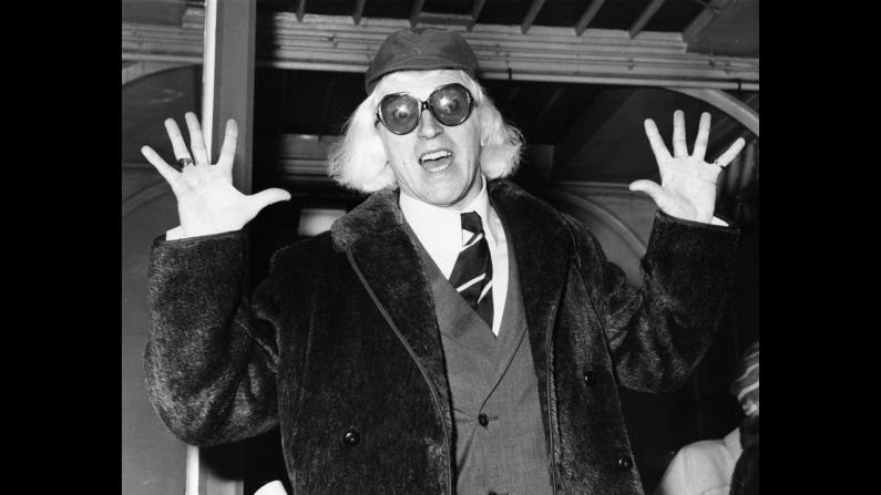 Savile arrives in London in 1972 on his way to Buckingham Palace, where he is to be awarded the Order of the British Empire.