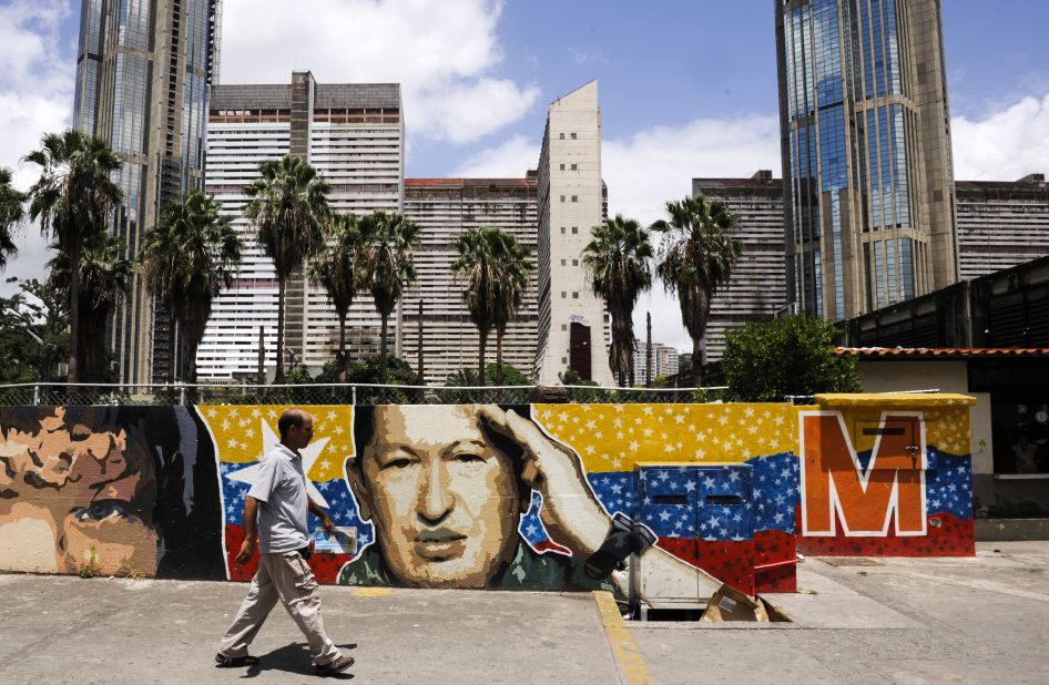 Journalist Girish Gupta says Venezuela is still recovering from the hangover of the brutal campaign between Hugo Chavez (pictured in a Caracas mural) and opposition challenger Henrique Capriles.