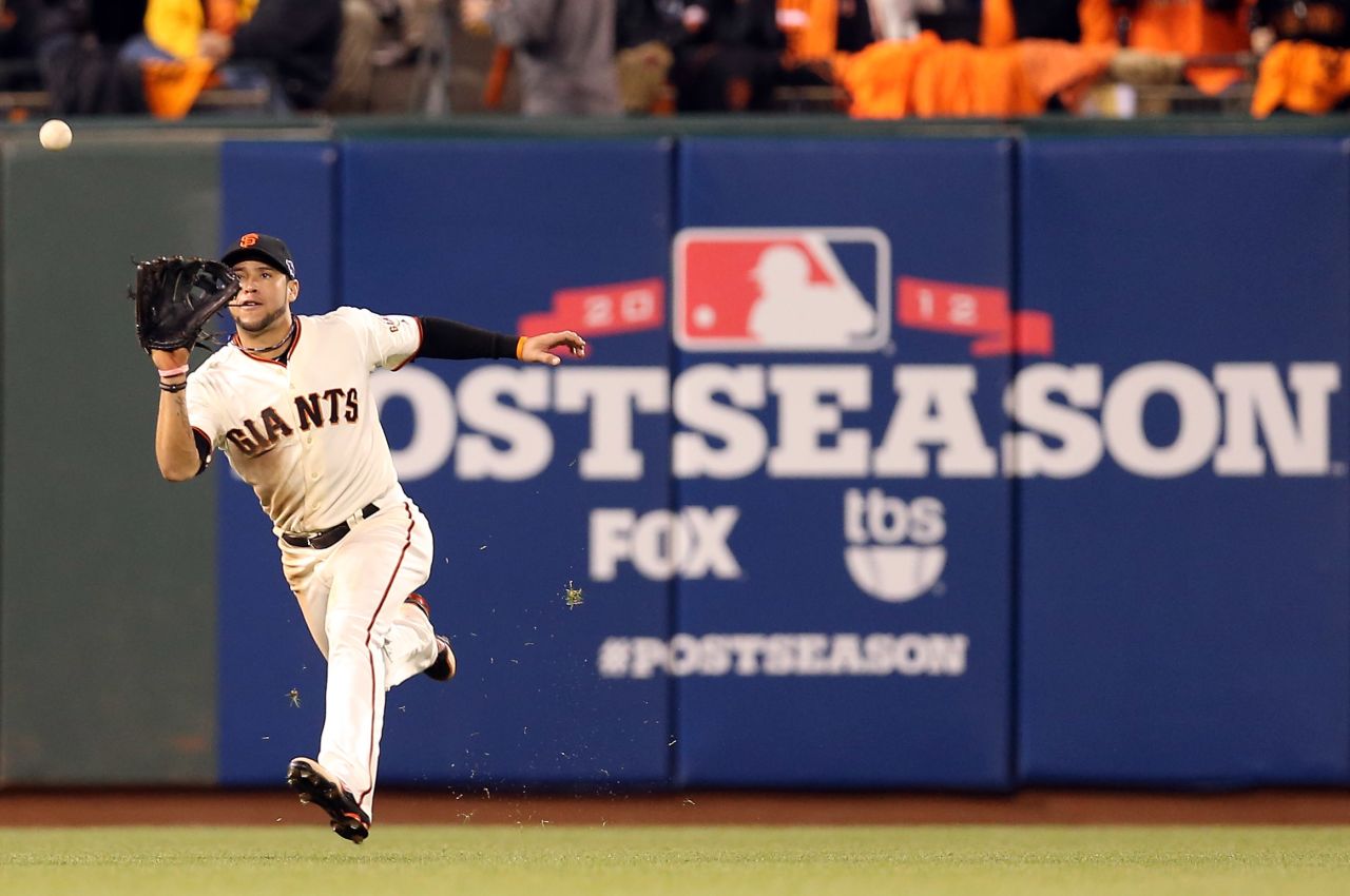 No. 7 Gregor Blanco of the Giants catches a fly ball in the fourth inning.
