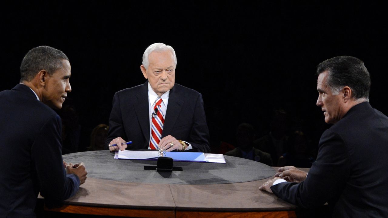 Obama and Romney face off while Schieffer looks on.