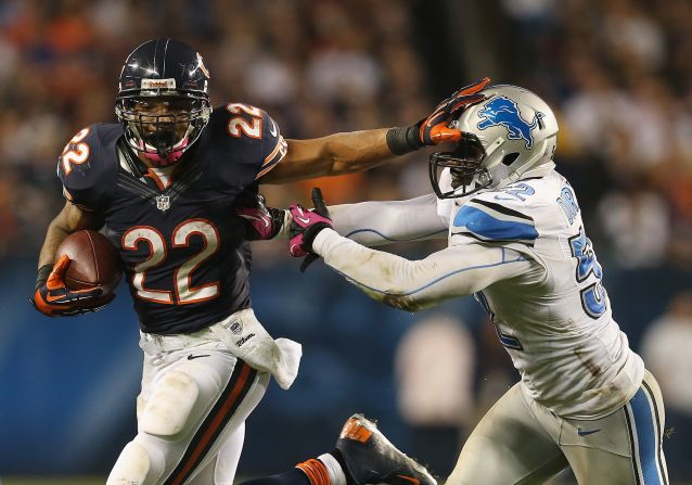 No. 22 Matt Forte of the Chicago Bears tries to hold off No. 52 Justin Durant of the Detroit Lions at Soldier Field on Monday, October 22, in Chicago.